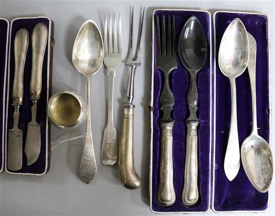 A Victorian silver table fork, three white metal spoons, a pistol handled carving fork, a white metal salt and two cased sets.